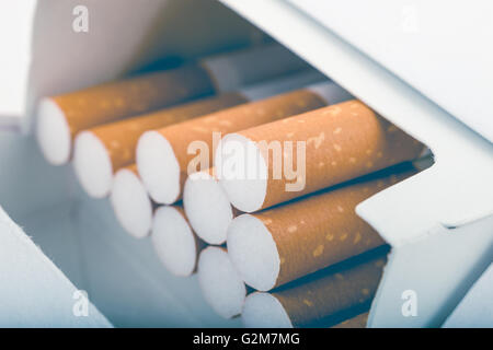 Side view of a pack of cigarettes with faded filter Stock Photo