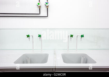 in an laboratory is an laboratory sink with faucets Stock Photo