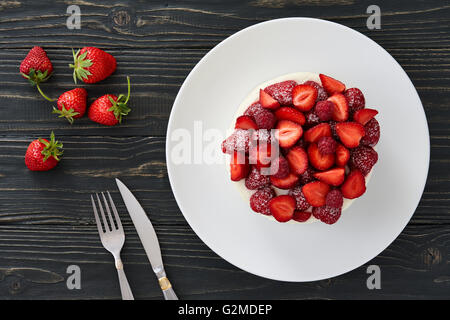 Berry cake on dark background Stock Photo