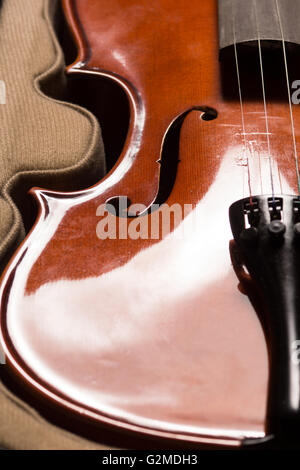 Old broken violin detailed shot Stock Photo