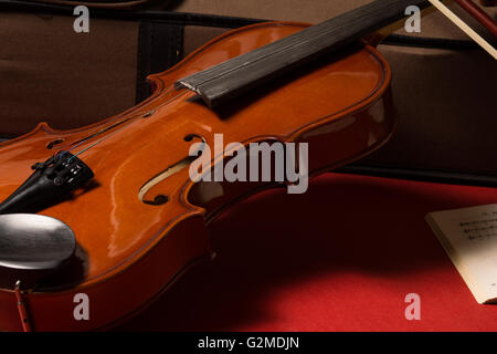 Old broken violin detailed shot Stock Photo