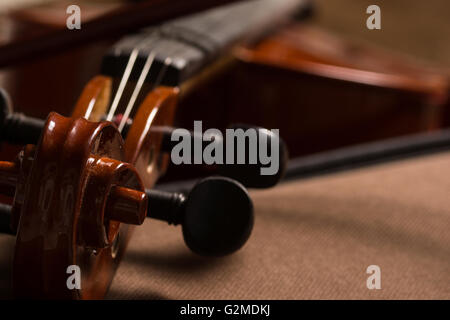 Old broken violin detailed shot Stock Photo