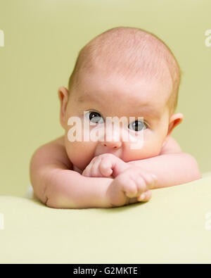 Baby infant kid lying on belly Stock Photo