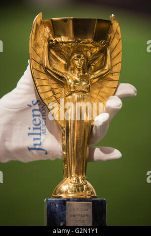London, UK. 1 June 2016. Pele's replica of the Jules Rimet Cup. Press preview of Pele - The Collection, a sale run by Julien's Auctions at Mall Galleries. Highlights include Pele's Jules Rimet Trophy; 1958, 1962 and 1970 World Cup Medals; Santos FC game worn jerseys and boots; awards received while playing with Santos FC; his 1977 New York Cosmos NASL championship ring; FIFA Player of the Century Award; L'Equipe Athlete of the Century Award; 2007 FIFA President's Award and the torch used by Pele when he ran in the 2004 Summer Olympics Torch Relay. Stock Photo