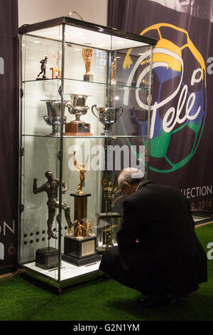 London, UK. 1 June 2016. Press preview of Pele - The Collection, a sale run by Julien's Auctions at Mall Galleries. Highlights include Pele's Jules Rimet Trophy; 1958, 1962 and 1970 World Cup Medals; Santos FC game worn jerseys and boots; awards received while playing with Santos FC; his 1977 New York Cosmos NASL championship ring; FIFA Player of the Century Award; L'Equipe Athlete of the Century Award; 2007 FIFA President's Award and the torch used by Pele when he ran in the 2004 Summer Olympics Torch Relay. Stock Photo