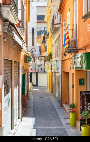 Traditional narrow street in center of town on May 20, 2016 in Lloret de Mar, Spain. These streets are traditional promenade are Stock Photo