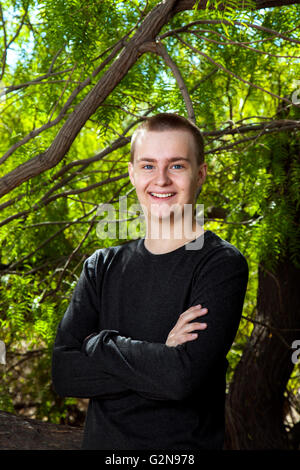 An outdoor portrait of a confident teenage boy. Stock Photo