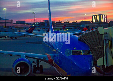 Sunrise over an airliner at Logan International Airport in East Boston, Massachusetts, USA. Stock Photo