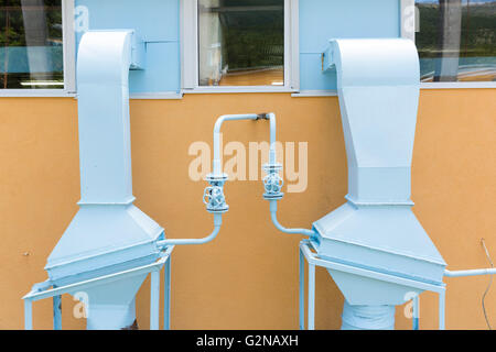 Industrial air conditioning and ventilation systems outside the wall of the plant. Stock Photo