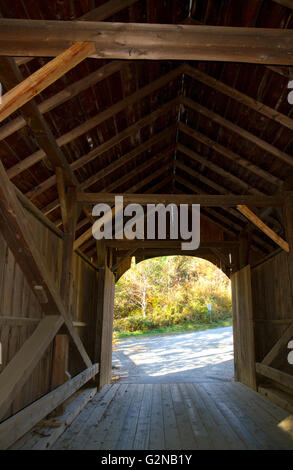 The Mill Covered Bridge crossing the Lamoille River in Belvidere, Vermont, USA. Stock Photo