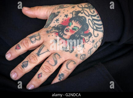 Close up of tattoo on hand of man at the  Venice Boardwalk in California Stock Photo