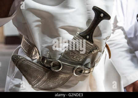 Traditional Omani Khanjar dagger worn in a sheath on a belt lined with ...