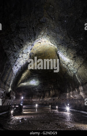 Dark, lit and empty Manjanggul Lava Tube Cave on Jeju Island in South Korea. Stock Photo