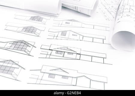 rolls of blueprints and architectural drawings of new house Stock Photo