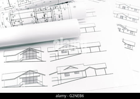rolls of blueprints and architectural drawings of new house Stock Photo