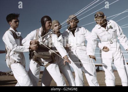 Instructor Explaining Operation of Parachute to Student Pilots, Meacham Field, Fort Worth, Texas, USA, Arthur Rothstein for Farm Security Administration (FSA), January 1942 Stock Photo