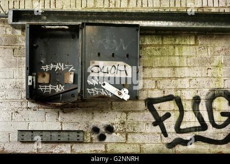 Stripped electrical cabinet in abandoned industrial building. Stock Photo