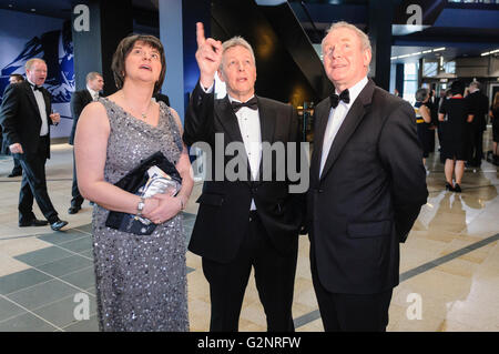 Belfast, UK. 30/03/2012 - Arlene Foster, Peter Robinson. and Martin McGuinnes admire the Belfast's  £97M Titanic Visitors Centre as it holds a pre-launch gala dinner. Stock Photo