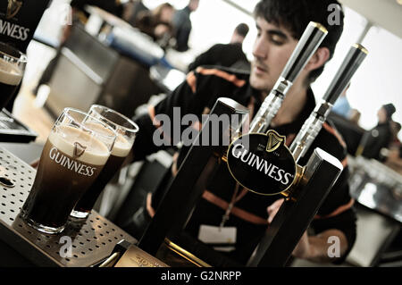 Bartender and two pints of Guinness at the Gravity Bar inside the Guinness Storehouse, Dublin, Ireland Stock Photo