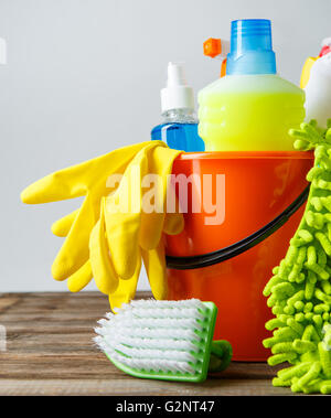 Bucket with cleaning items on light background Stock Photo