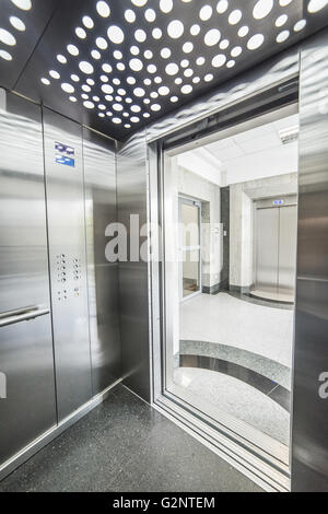 interior of a modern elevator - shiny steel and lighting Stock Photo