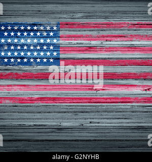 American remembrance day background rustic antique USA flag painted on old weathered wood as a patriotic symbol for memorial day observance as a traditional holiday symbol to honor the veterans in a 3D illustration style. Stock Photo