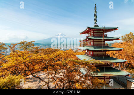 Travel in Japan - Beuatiful autumn in Japan at Red pagoda with Mt. Fuji in background, Japan.