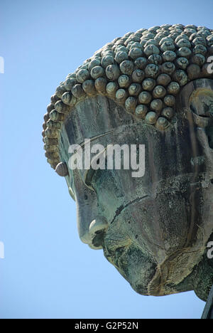 Kamakura, Japan - August 12, 2007: Close-up view of the Great Buddha statue, a popular destination for Shinto Buddhists and tourists alike in Japan. Stock Photo