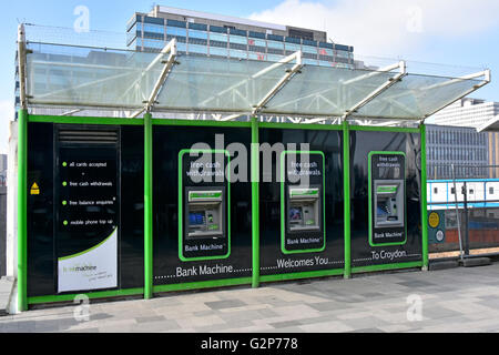 Three bank machine atm cash hole in the wall cashpoint money dispenser machines outside Croydon East train station London England UK Stock Photo