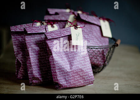 Violet Gift Bags with Name Tags at childs birthday party Stock Photo