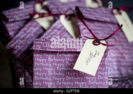 Violet Gift Bags with Name Tags at childs birthday party Stock Photo