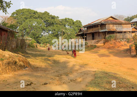 Shan village at sunset and children playing in the street. Countryside of Shan state, Myanmar, Burma, South Asia, Asia Stock Photo