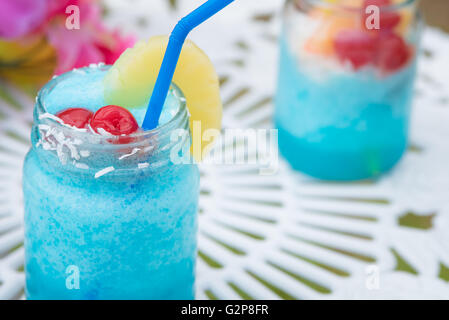 Close up of blue cocktail alcohol drink with fruit Stock Photo