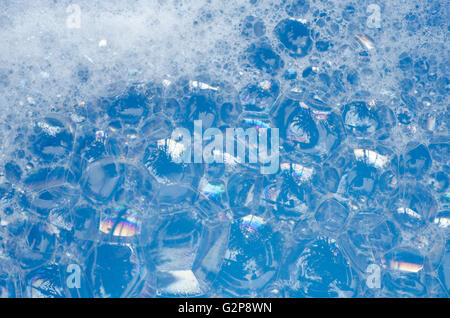 closeup to foam bubbles on blue background Stock Photo