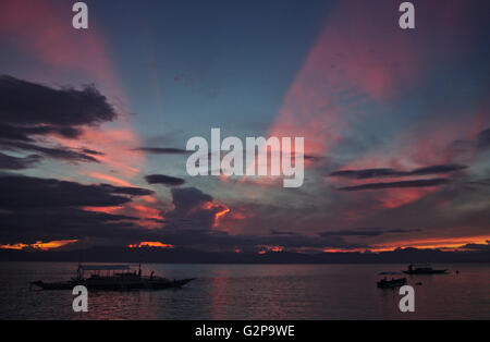 Dramatic sunset in Moalboal on Cebu, with Negros in the back, Visayas, Philippines Stock Photo