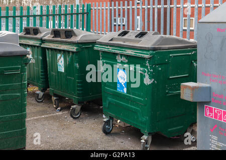 General waste and recycling bins or containers in a community recycling point Stock Photo