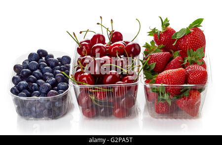 blueberry, cherry and strawberry in plastic transparent container box, isolated on white background Stock Photo