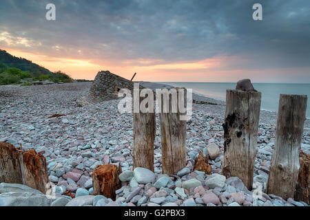 Beautiful sunset over the beach at Porlock Weir, a part of Exmoor National Park in Somerset Stock Photo