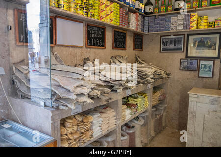 Shop selling Bacalhau, dried and salted cod fish, a popular item for Portuguese cuisine. Stock Photo