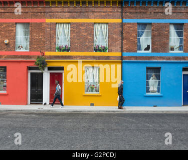 Bright coloured painted terrace houses on Baronet Street, Derry, Londonderry, Northern Ireland. UK. Europe Stock Photo