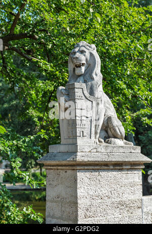 Lion statue in front of Vajdahunyad Castle, City Park of Budapest, Hungary. Stock Photo