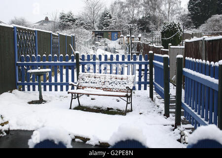 image of snow covered urban garden in winter Stock Photo