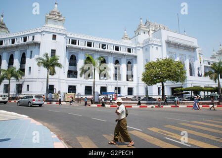 A man on zebra crossing in front of City Hall, Yangon, Yangon State, Myanmar Stock Photo