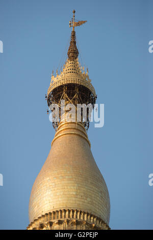 Decorative umbrella on top of golden stupa at Shwedagon Pagoda, Yangon, Myanmar Stock Photo