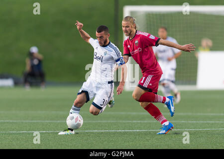 June 01, 2016: Vancouver Whitecaps Russell Teibert (31) runs with the ball while Ottawa Fury FC Mozzi Gyorio (11) chases during the Amway Canadian Championship match between Vancouver Whitecaps and Ottawa Fury FC at TD Place Stadium in Ottawa, ON, Canada. Ottawa Fury FC won the first leg of the semifinal 2-0. Daniel Lea/CSM Stock Photo