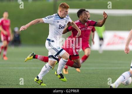 June 01, 2016: Vancouver Whitecaps Tim Parker (26) and Ottawa Fury FC Dennis Chin (15) in action during the Amway Canadian Championship match between Vancouver Whitecaps and Ottawa Fury FC at TD Place Stadium in Ottawa, ON, Canada. Ottawa Fury FC won the first leg of the semifinal 2-0. Daniel Lea/CSM Stock Photo