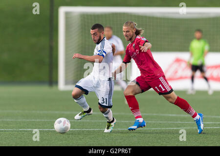 June 01, 2016: Vancouver Whitecaps Russell Teibert (31) and Ottawa Fury FC Mozzi Gyorio (11) in action during the Amway Canadian Championship match between Vancouver Whitecaps and Ottawa Fury FC at TD Place Stadium in Ottawa, ON, Canada. Ottawa Fury FC won the first leg of the semifinal 2-0. Daniel Lea/CSM Stock Photo