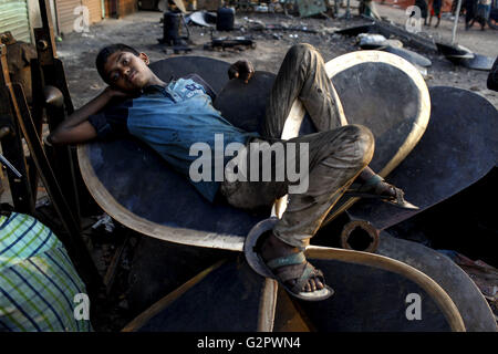 Dhaka, Dhaka, Bangladesh. 2nd June, 2016. Jun 02, 2016 Dhaka, Bangladesh ""“ A young worker take rest after work at a ship propeller making factory in sadarghat dockyard. The laborers work in the dockyard without proper safety measures and unsafe conditions. Mostly the Local Ships are built and repair in this place. Ship repair, Sewage from the city, oil spills from boats and chemicals from industry have all led to pollution in the Burigonga River. © K M Asad/ZUMA Wire/Ģ����ý Live News Stock Photo