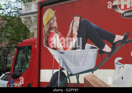 Woman sat in wheelbarrow Stock Photo - Alamy