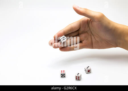 Human hand ready to roll the dice on white isolated background - Try luck, Take Risk or Business concept (Focus on hands) Stock Photo